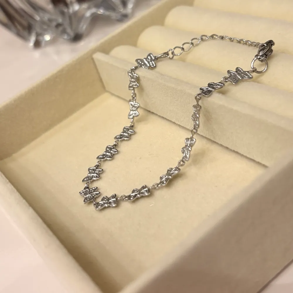 Pulseira encontro de borboletas em aço inoxidável