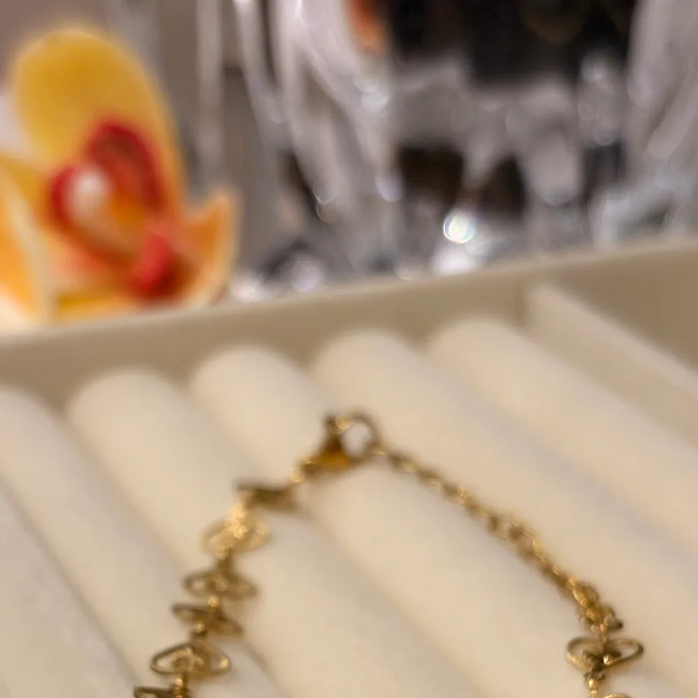 Pulseira corações floquinhos em aço inoxidável
